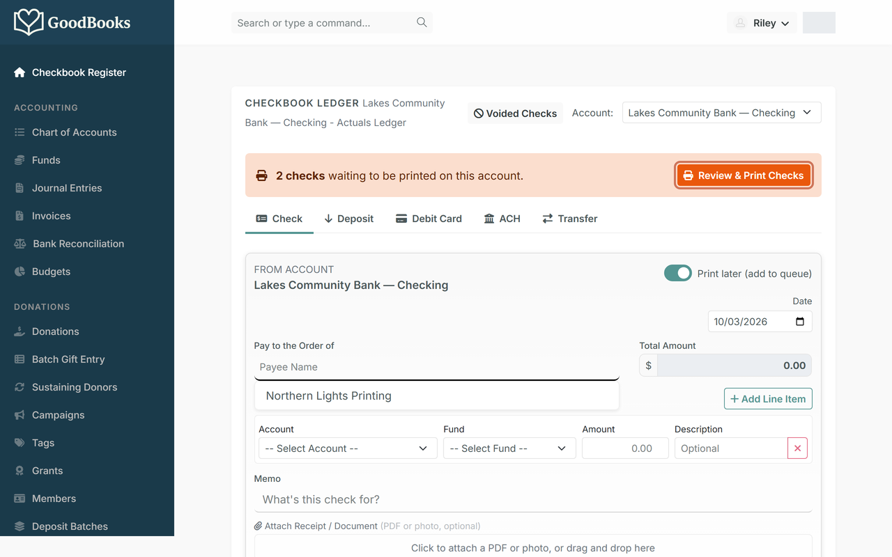 The register showing the orange banner with the Review & Print Checks button highlighted